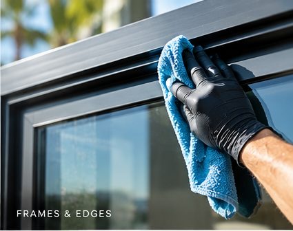 Wiping a window frame and its edges with a microfiber cloth